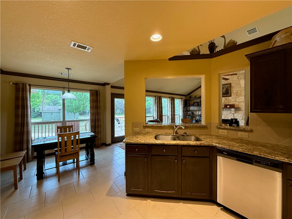 28799 Highway 83 Concan, TX 78838 - Photo 32 of 40 a living room with granite countertop kitchen furniture and a large window