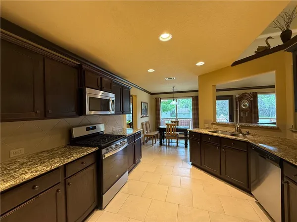 a kitchen with a sink and counter top space