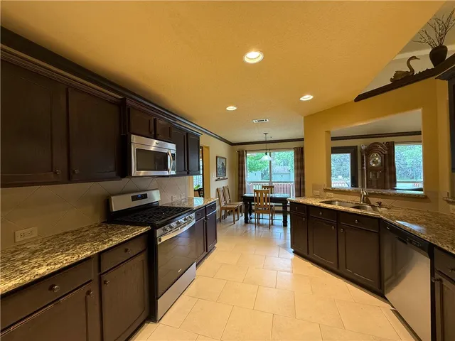a kitchen with a sink and counter top space