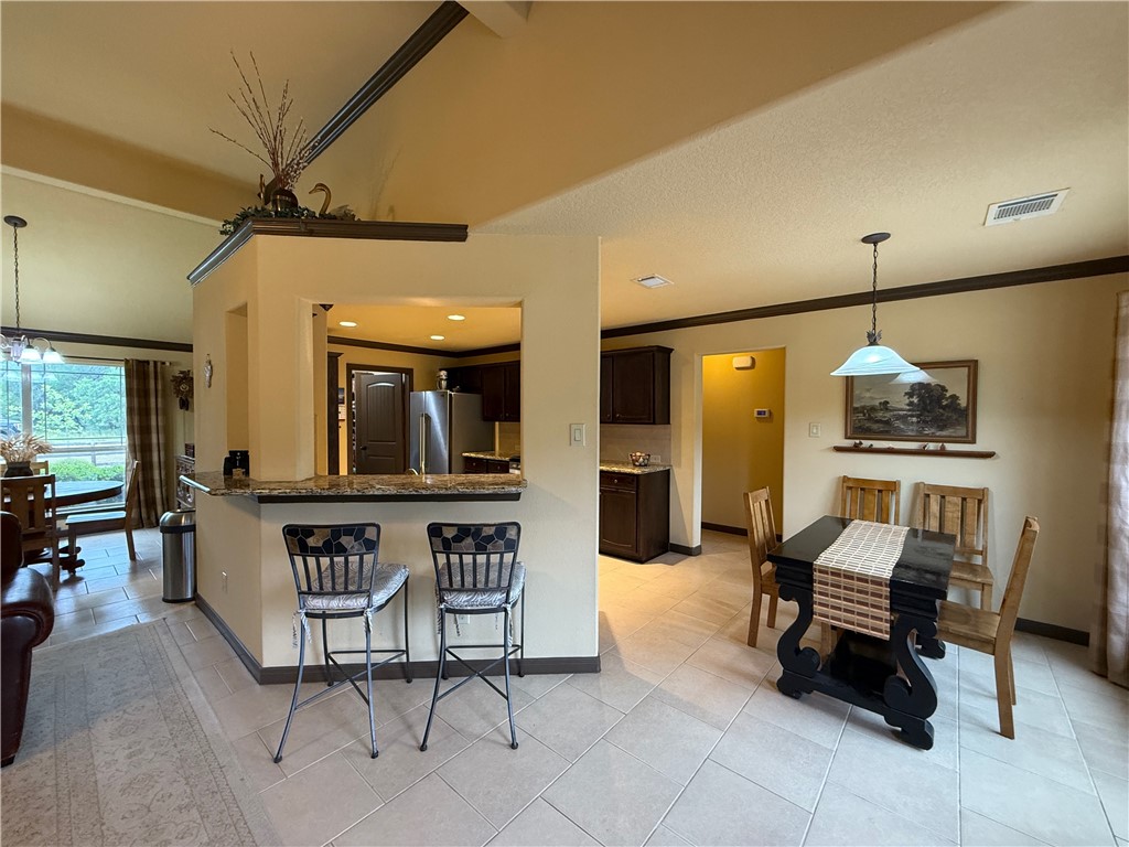 28799 Highway 83 Concan, TX 78838 - Photo 34 of 40 a living room with furniture a rug and chairs