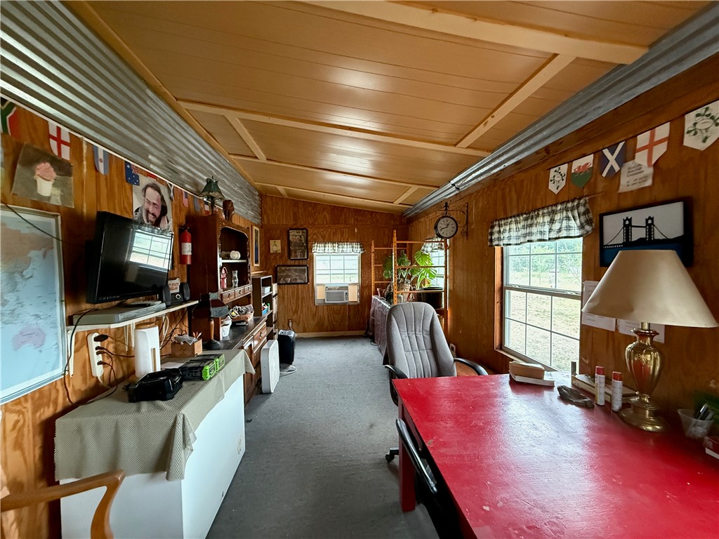 28799 Highway 83 Concan, TX 78838 - Photo 35 of 40 a living room with furniture and a flat screen tv