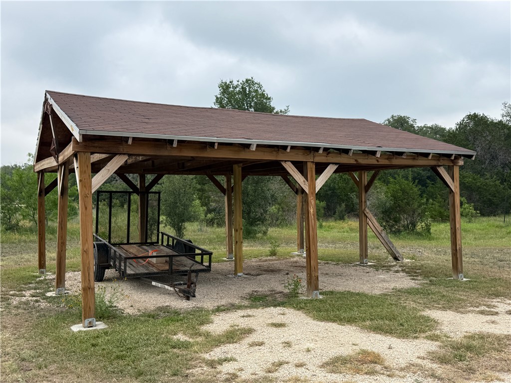 28799 Highway 83 Concan, TX 78838 - Photo 37 of 40 a backyard of a house with barbeque oven table and chairs