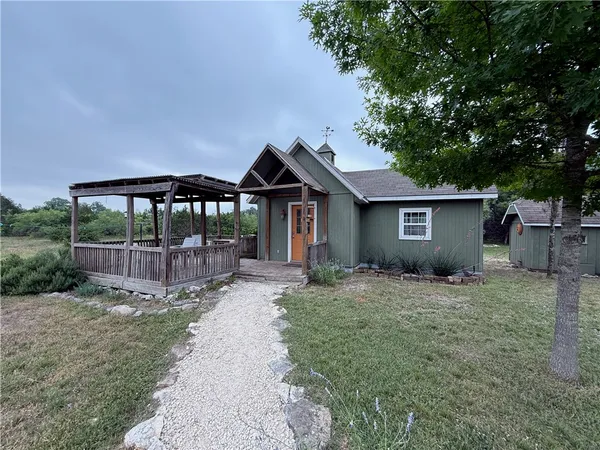 a house view with a garden space