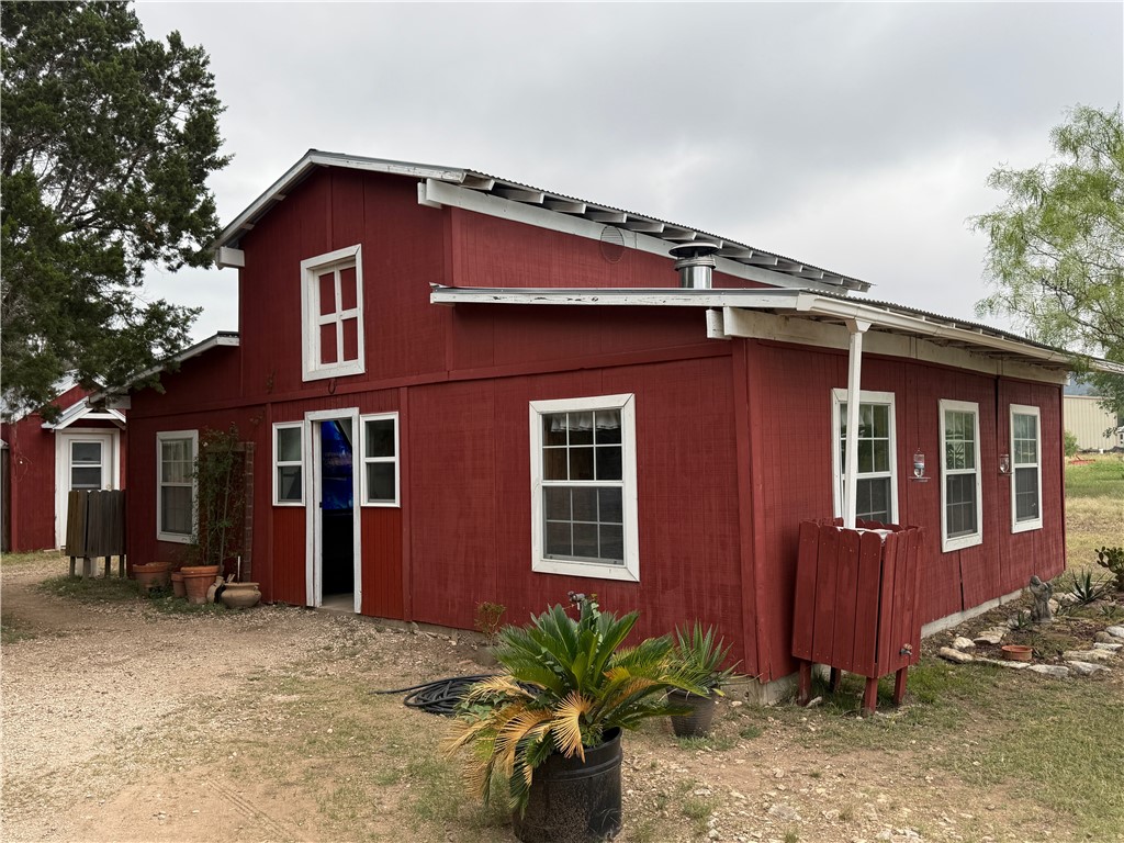 28799 Highway 83 Concan, TX 78838 - Photo 7 of 40 a front view of a house with a yard