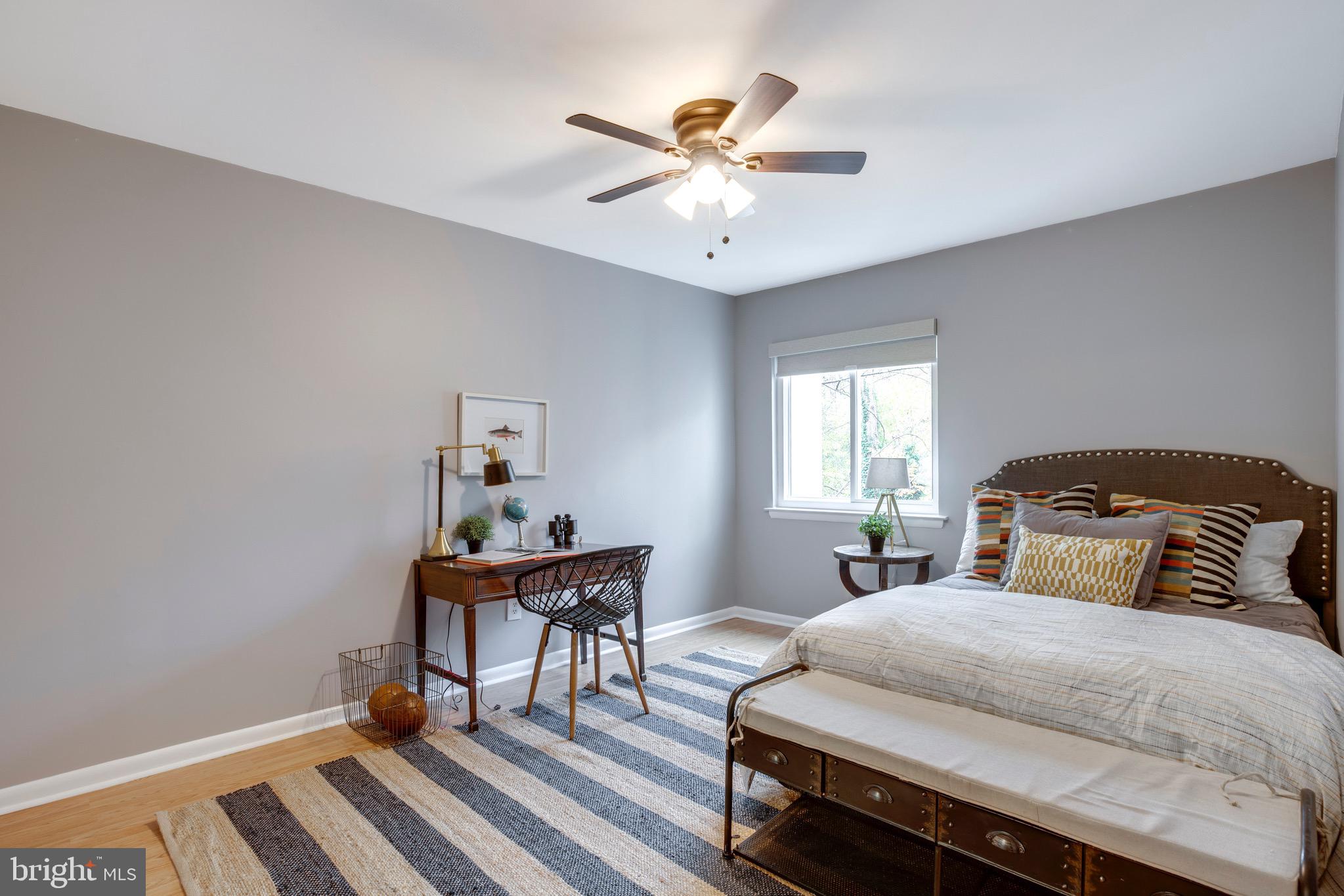 2318 Millennium Lane Reston, VA 20191 - Photo 18 of 34 a bedroom with a bed and a table in it