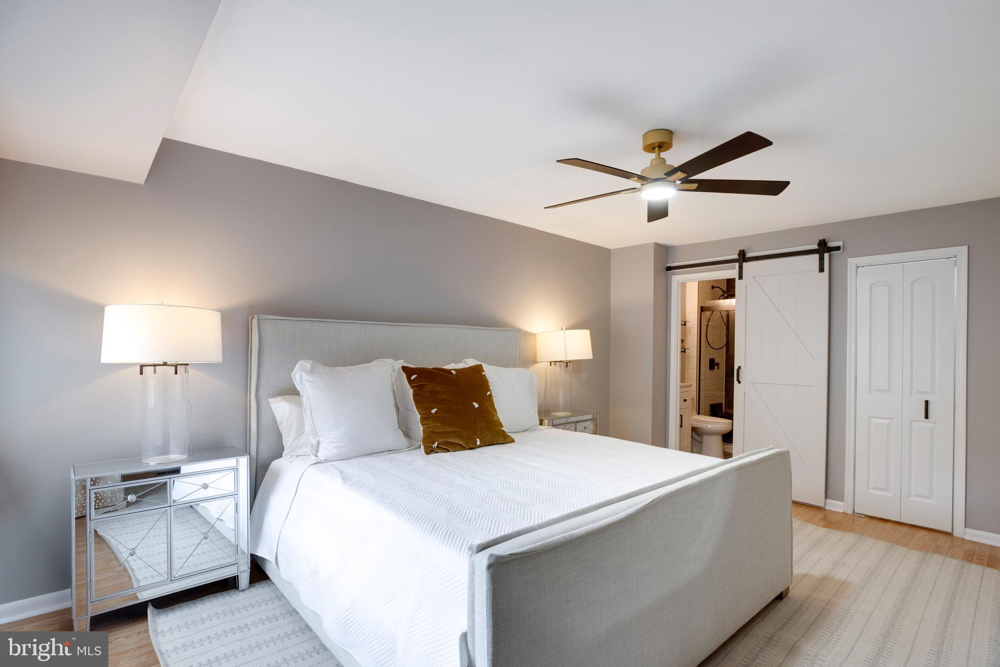 2318 Millennium Lane Reston, VA 20191 - Photo 21 of 34 a bedroom with a bed and a ceiling fan