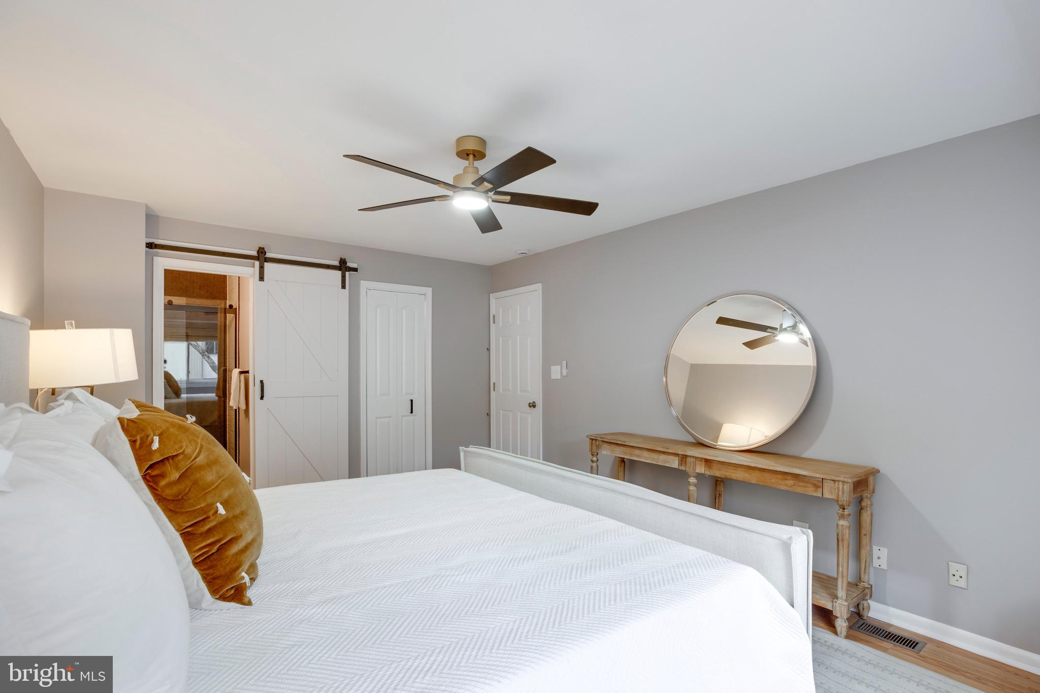 2318 Millennium Lane Reston, VA 20191 - Photo 22 of 34 a bedroom with a bed and a large mirror