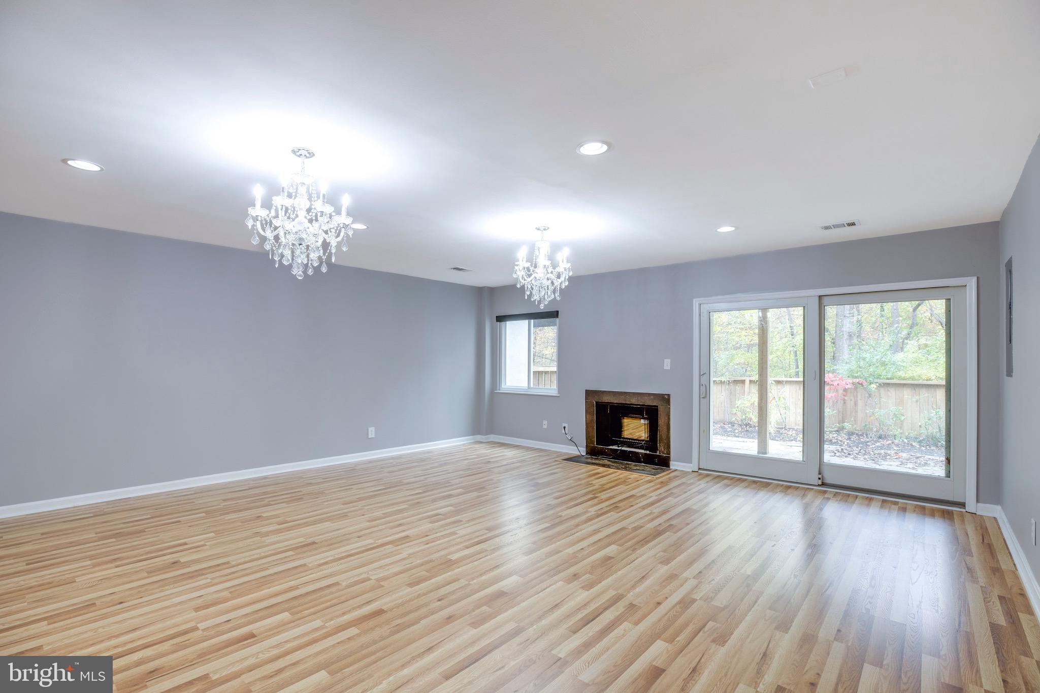 2318 Millennium Lane Reston, VA 20191 - Photo 26 of 34 wooden floor fireplace and windows in an empty room