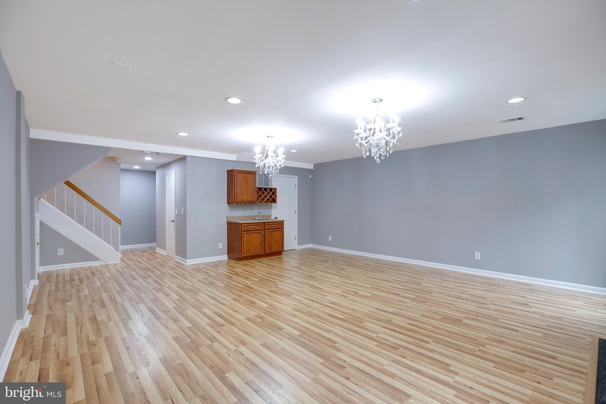2318 Millennium Lane Reston, VA 20191 - Photo 27 of 34 a view of a kitchen with a sink and a chandelier