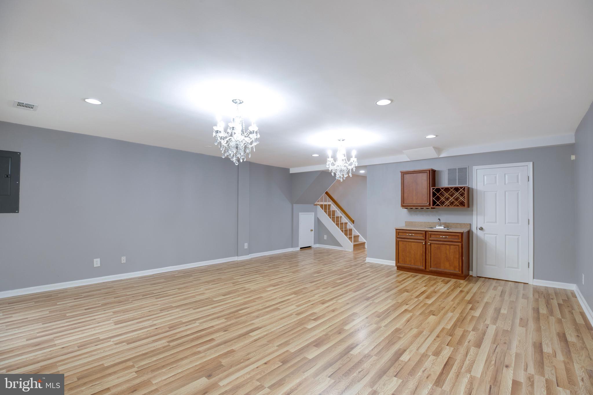 2318 Millennium Lane Reston, VA 20191 - Photo 28 of 34 a view of a room with kitchen island stainless steel appliances wooden floor and window