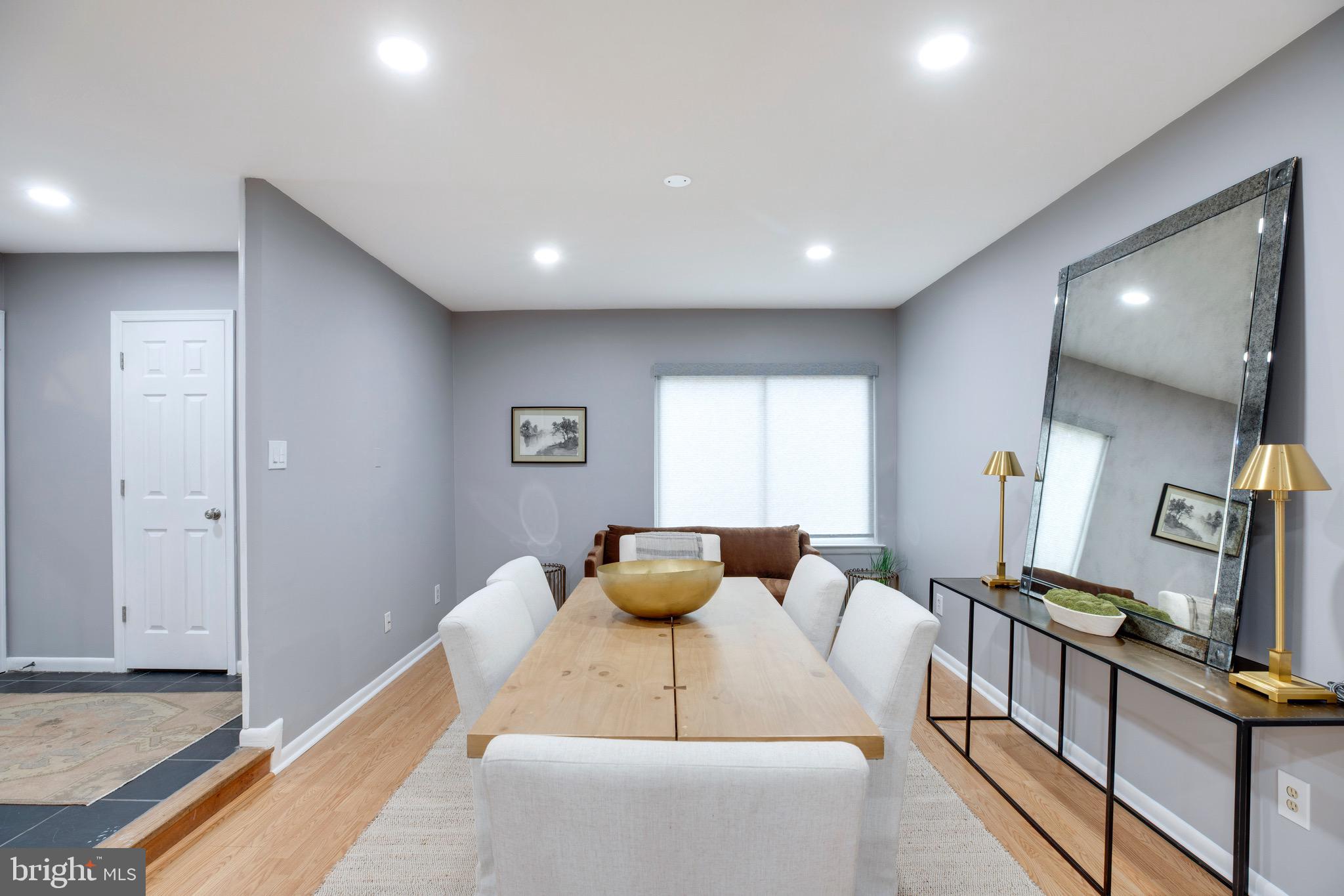 2318 Millennium Lane Reston, VA 20191 - Photo 4 of 34 a living room with furniture and a flat screen tv