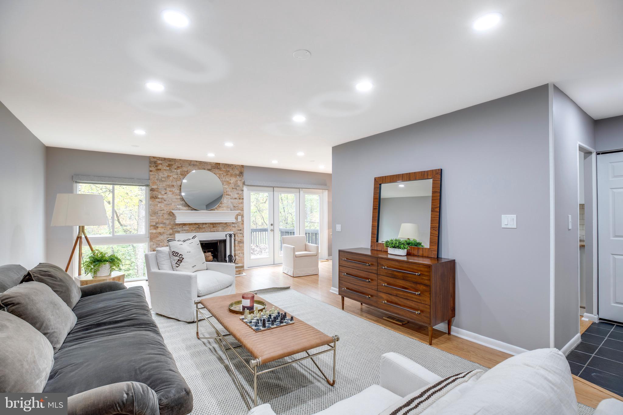 2318 Millennium Lane Reston, VA 20191 - Photo 7 of 34 a living room with furniture a rug and a table