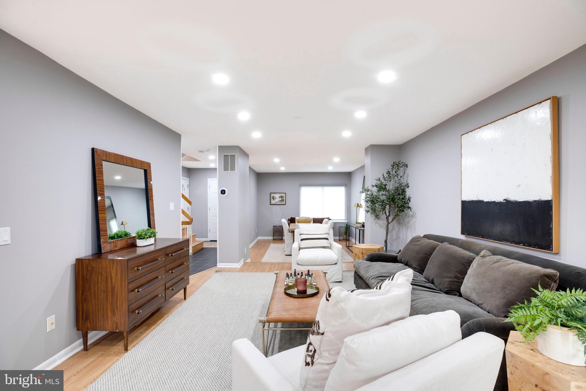 2318 Millennium Lane Reston, VA 20191 - Photo 8 of 34 a living room with furniture and a flat screen tv