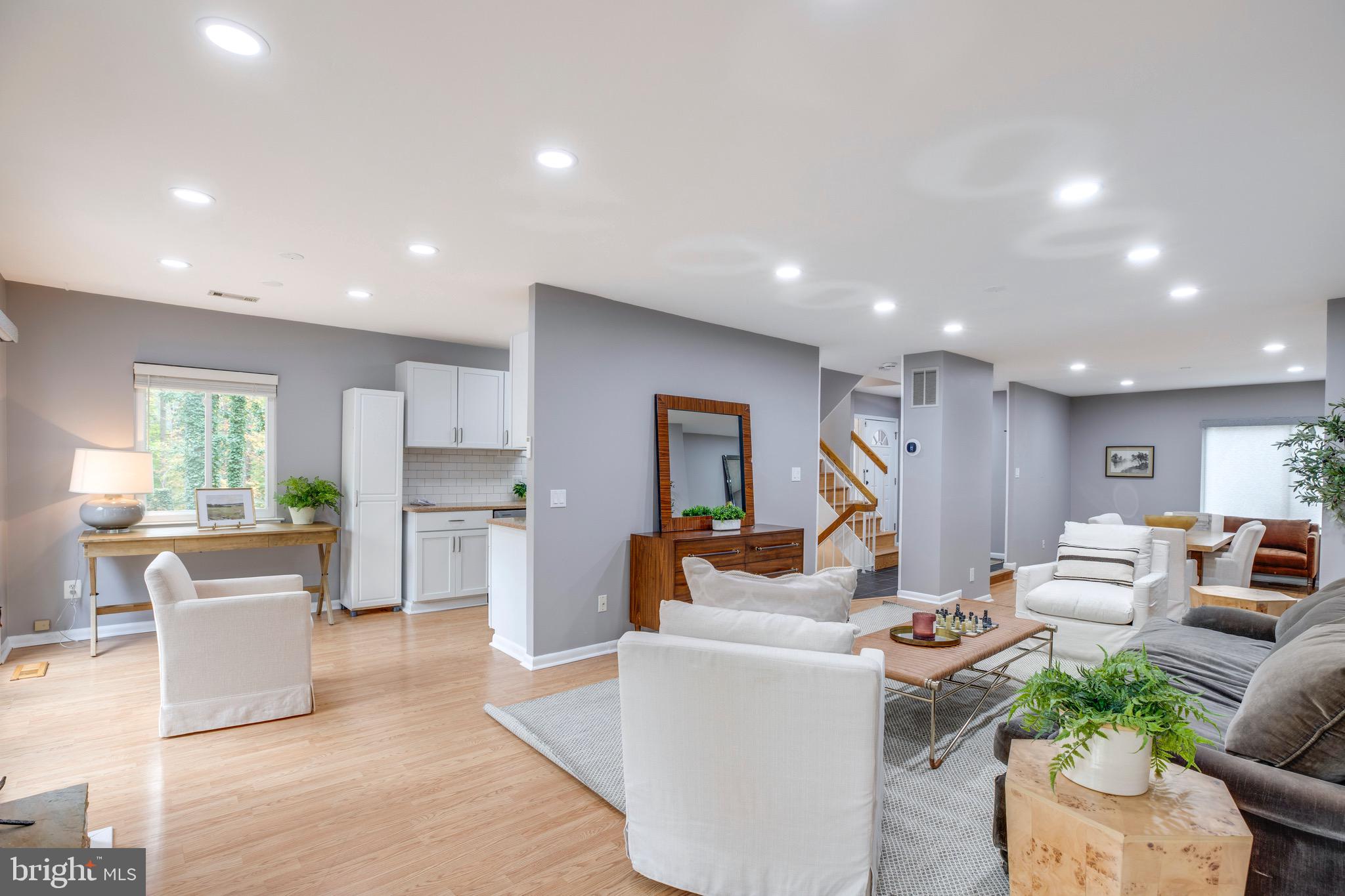 2318 Millennium Lane Reston, VA 20191 - Photo 9 of 34 a living room with furniture kitchen view and a large window