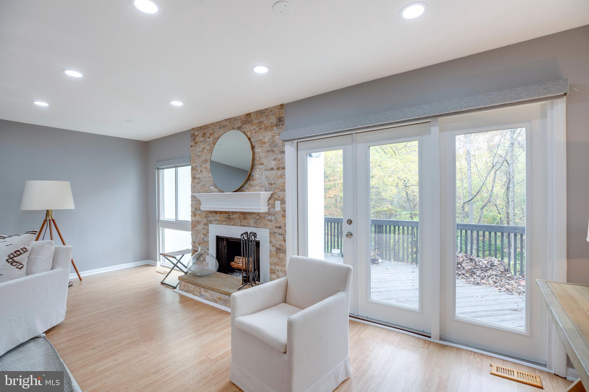 2318 Millennium Lane Reston, VA 20191 - Photo 10 of 34 a living room with furniture and a fireplace