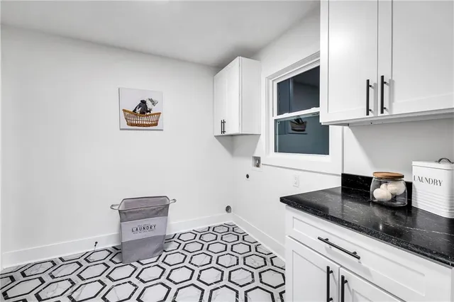 a kitchen with a sink cabinets and window