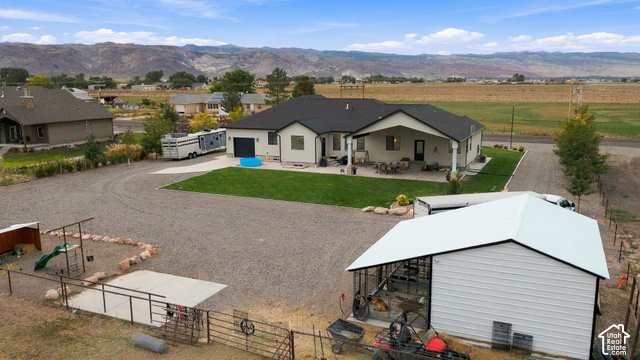 244 East Sevier River Road Central Valley, UT 84754 - Photo 5 of 66 Single-story residence with a covered patio, attached garage, and a separate metal outbuilding