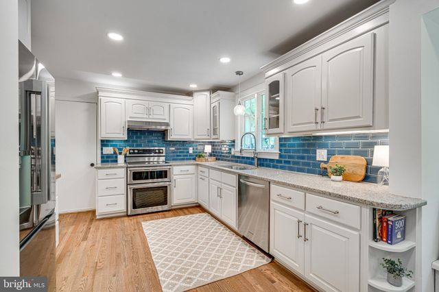 a bedroom with a bed and a lamp