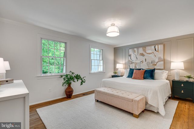 a view of a room with racks on the wall and a window