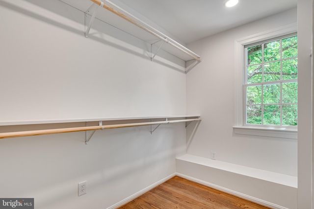 a bedroom with a bed and a night stand