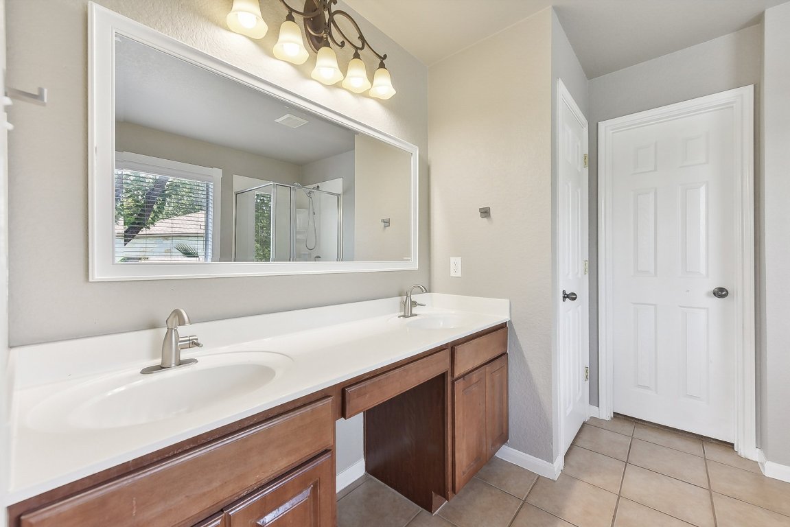 217 Newport Landing Place Round Rock, TX 78665 - Photo 18 of 30 Primary Bathroom with dual vanities