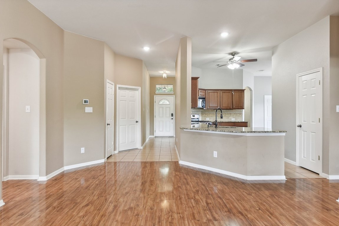 217 Newport Landing Place Round Rock, TX 78665 - Photo 4 of 30 Open Floor Kitchen opens up to Living Area