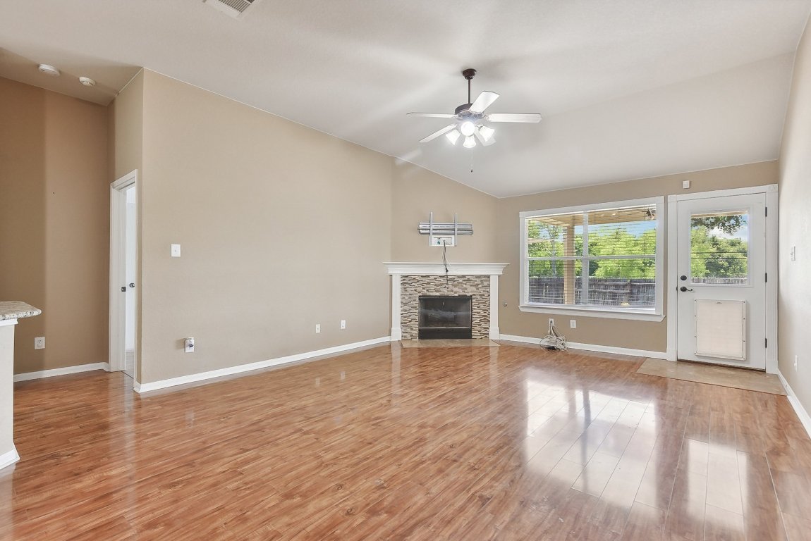 217 Newport Landing Place Round Rock, TX 78665 - Photo 5 of 30 Tall ceilings with large windows bringing in abundant light