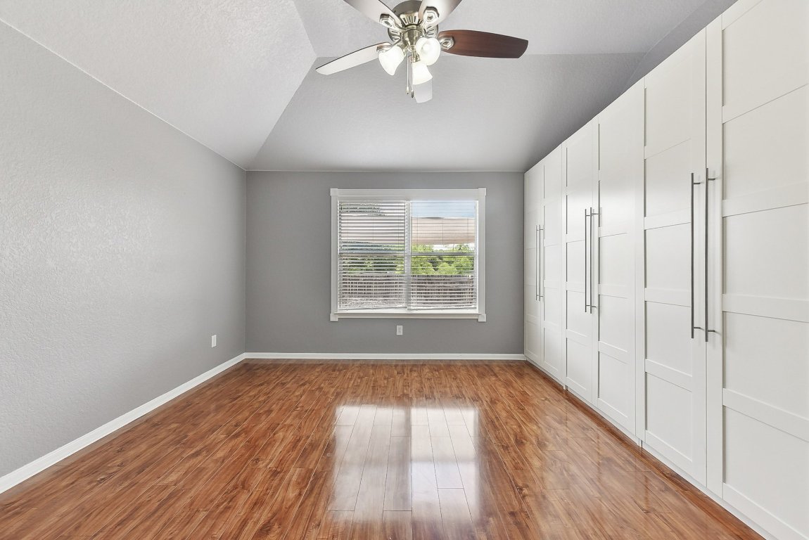 217 Newport Landing Place Round Rock, TX 78665 - Photo 7 of 30 Spacious Primary Bedroom with custom cabinetry