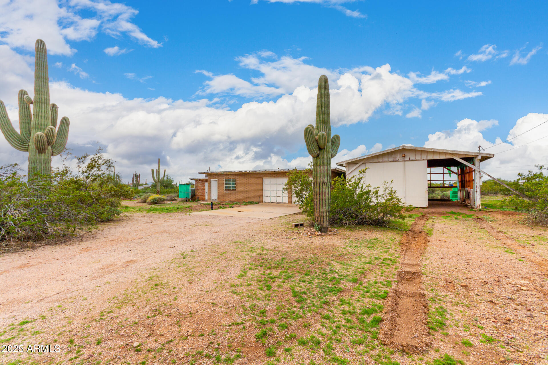 1126 North Goldfield Road Apache Junction, AZ 85119 - Photo 3 of 14 a front view of a house with a yard and trees
