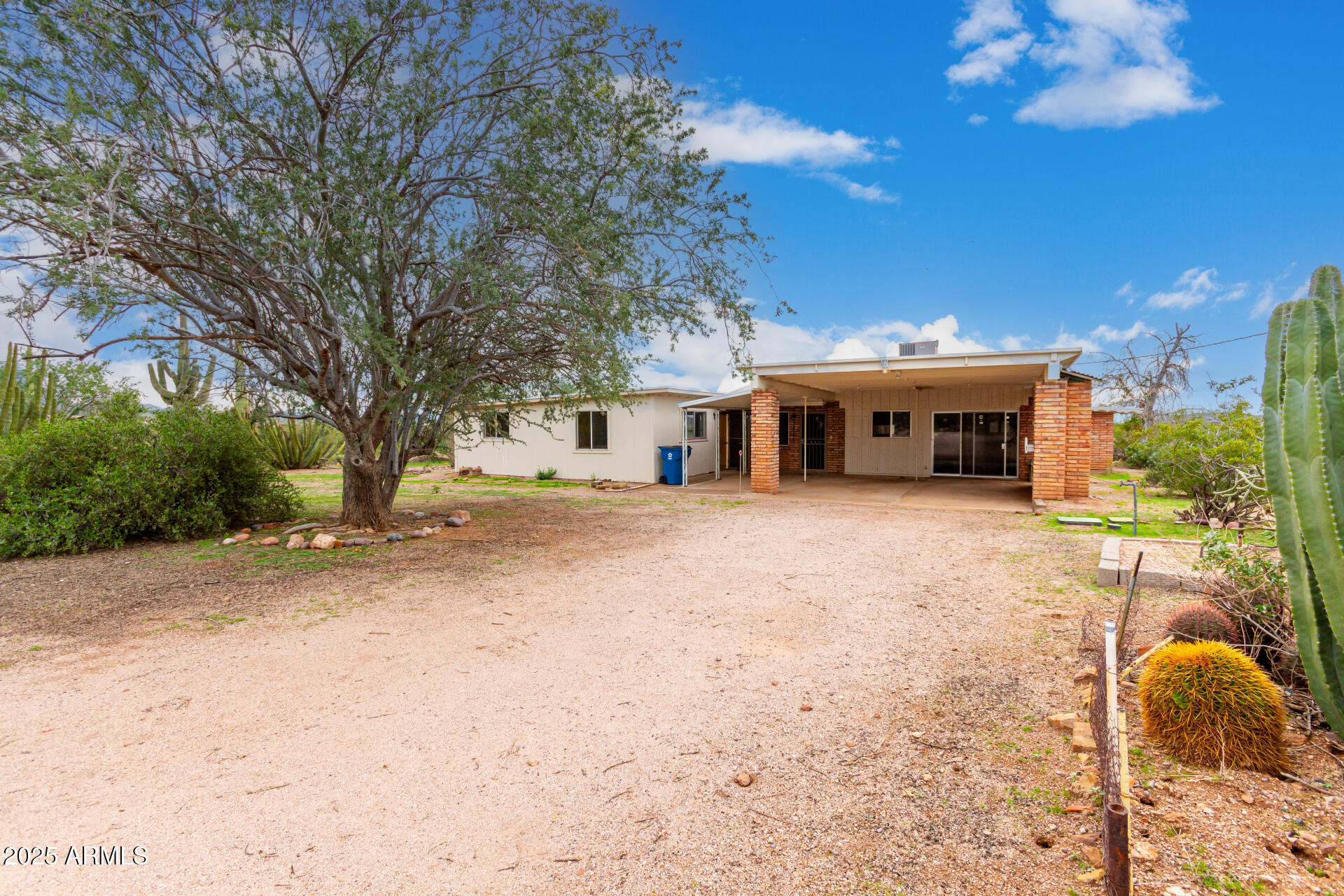 1126 North Goldfield Road Apache Junction, AZ 85119 - Photo 5 of 14 a house with trees in front of it
