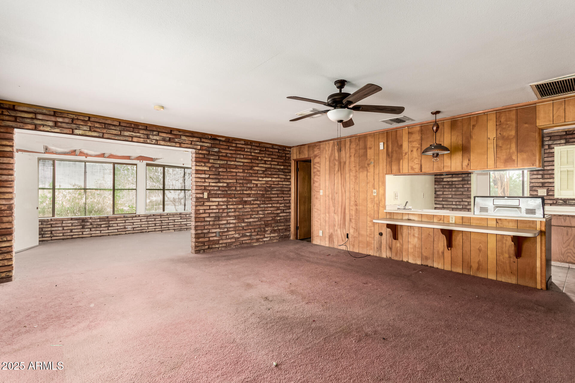 1126 North Goldfield Road Apache Junction, AZ 85119 - Photo 9 of 14 a view of an empty room with a window