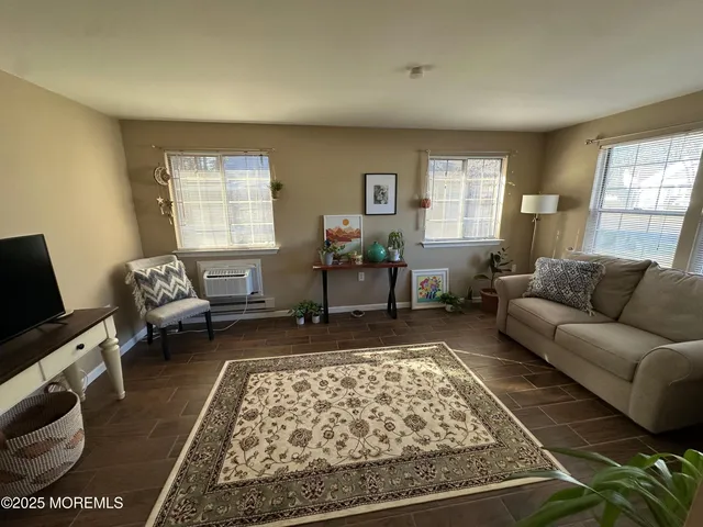 a living room with furniture or couch and a window