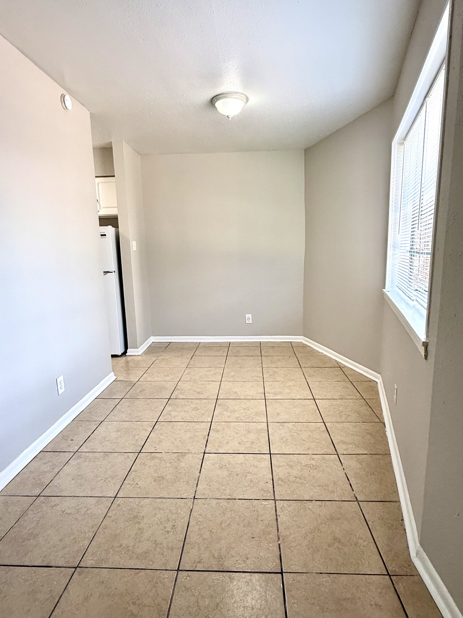 1518 Wirt Road, Unit 6 Houston, TX 77055 - Photo 3 of 14 a view of an empty room and window