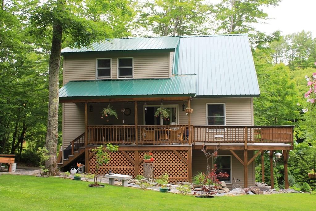 558 Rockwood Road Greenville Junction, ME 04442 - Photo 7 of 31 Covered porch and front deck. Stone...