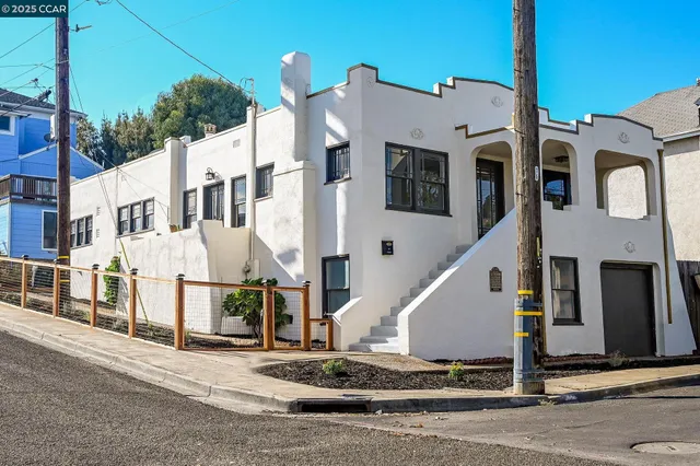a view of a white building among the street