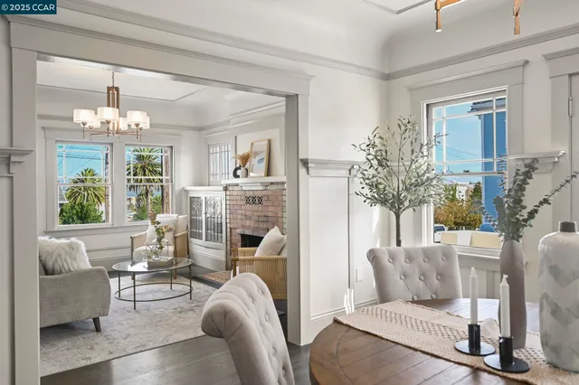 a kitchen with a sink a stove a dining table and chairs