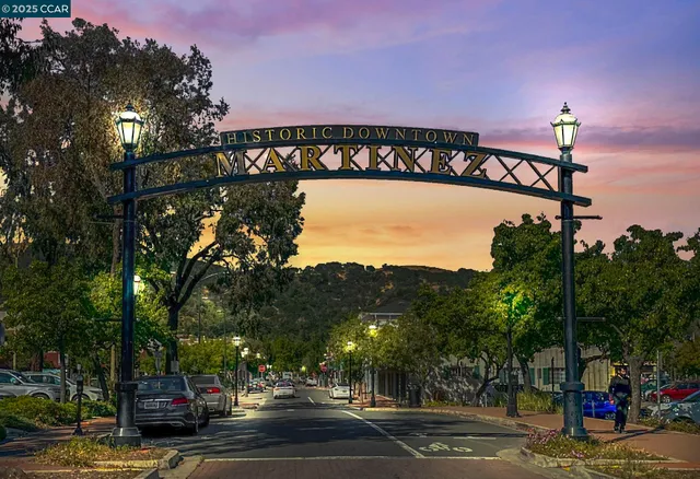 a front view of a building with tree s