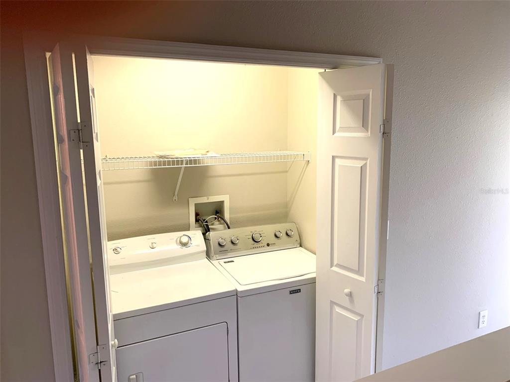 11106 Windsor Pl Circle Tampa, FL 33626 - Photo 16 of 24 a utility room with dryer and washer