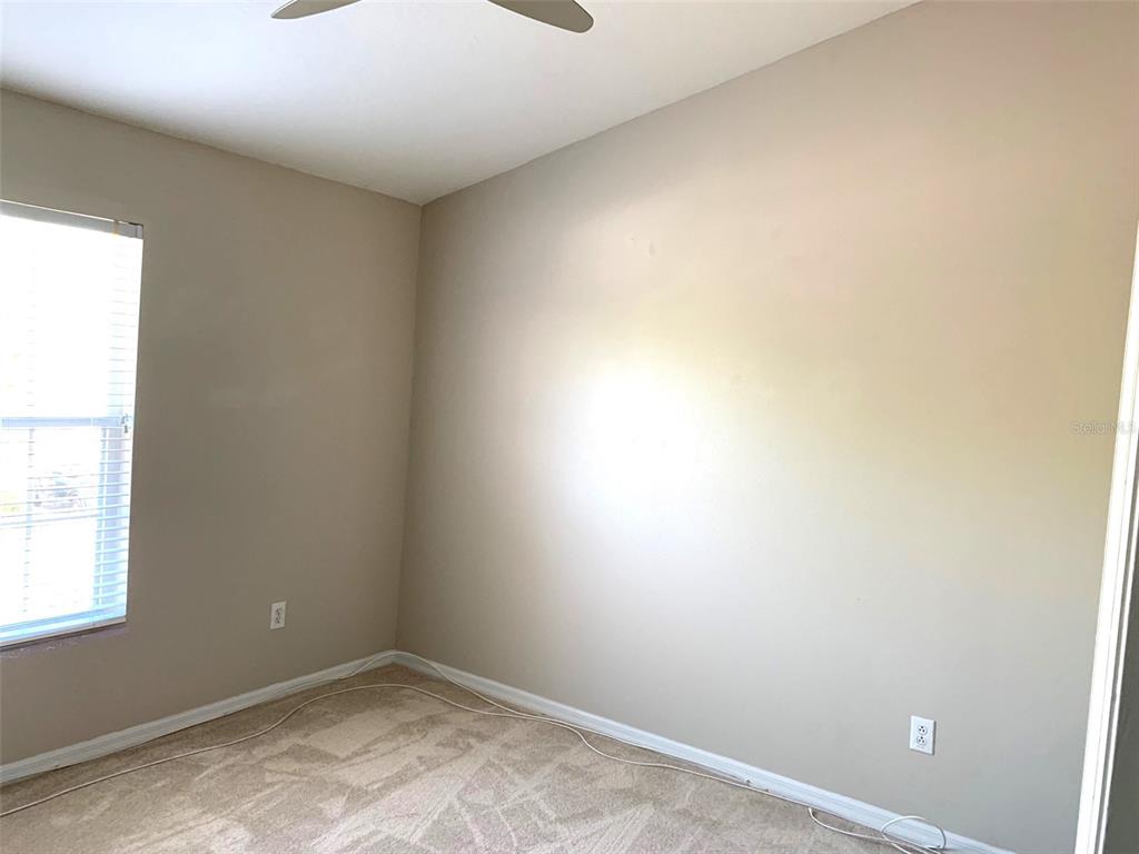 11106 Windsor Pl Circle Tampa, FL 33626 - Photo 17 of 24 an empty room with a window