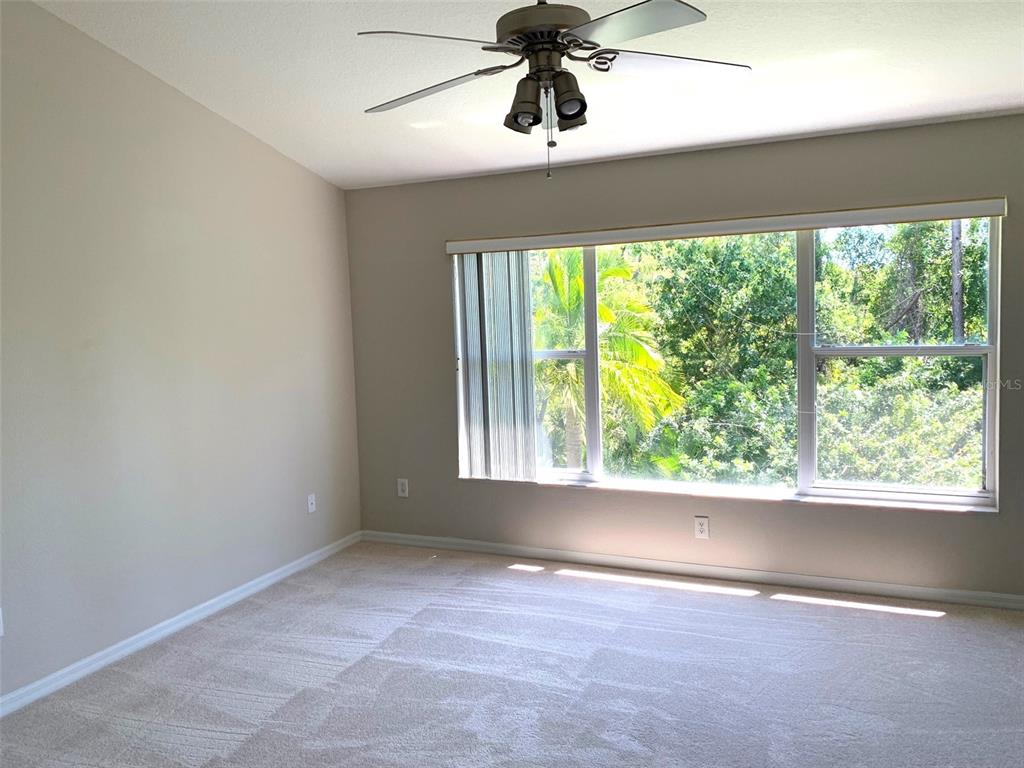 11106 Windsor Pl Circle Tampa, FL 33626 - Photo 19 of 24 an empty room with a window
