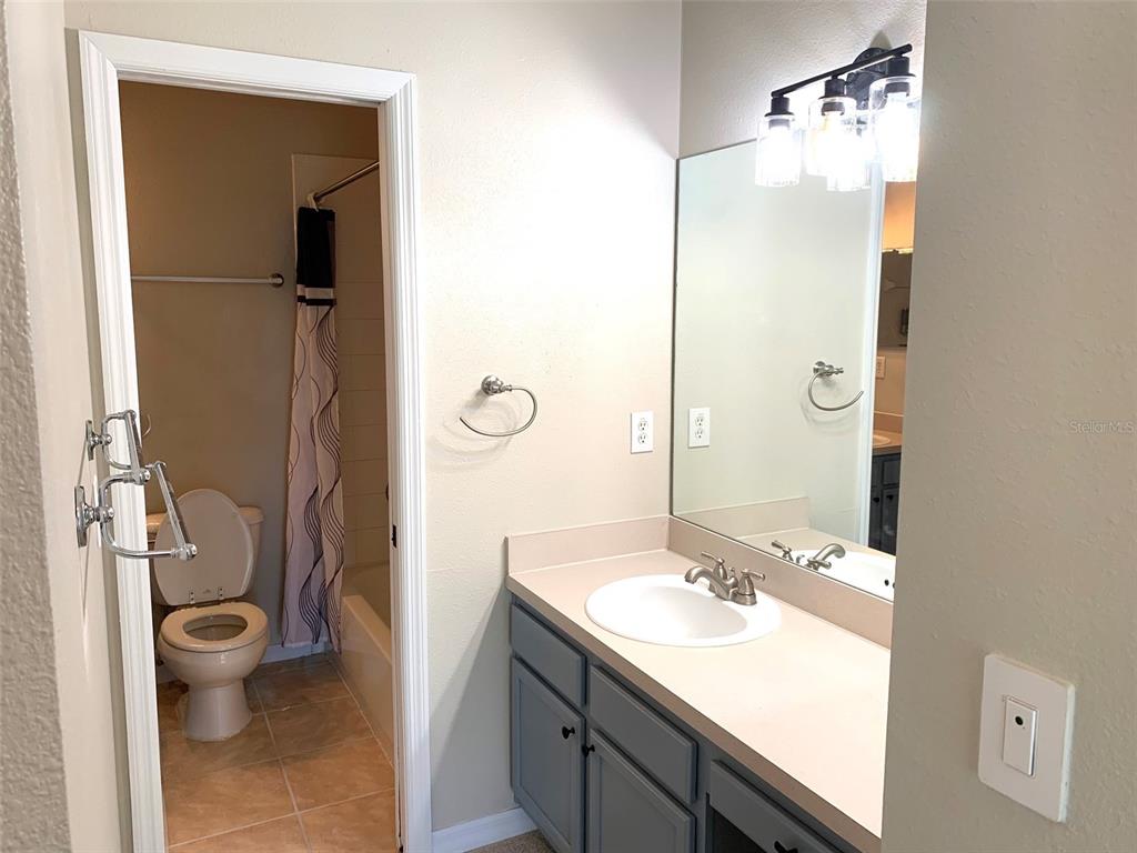 11106 Windsor Pl Circle Tampa, FL 33626 - Photo 22 of 24 a bathroom with a sink toilet and shower