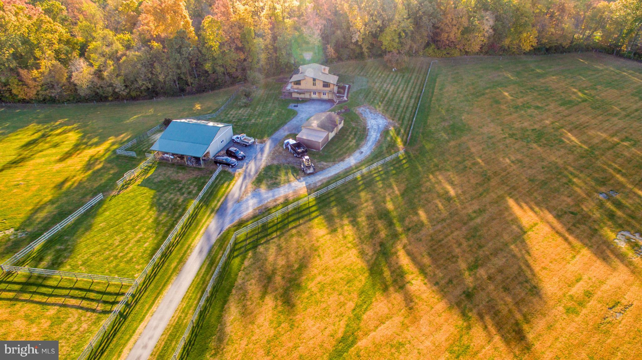 3160 Sumantown Road Middletown, MD 21769 - Photo 1 of 25 a aerial view of a house with swimming pool in front of it