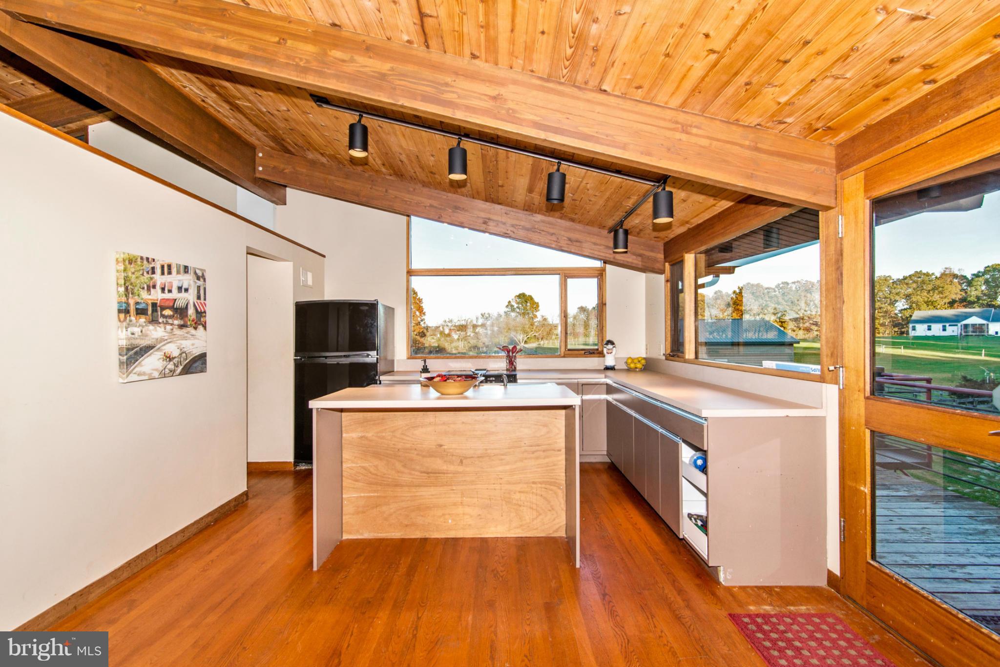 3160 Sumantown Road Middletown, MD 21769 - Photo 11 of 25 a open kitchen with stainless steel appliances granite countertop a stove and a refrigerator