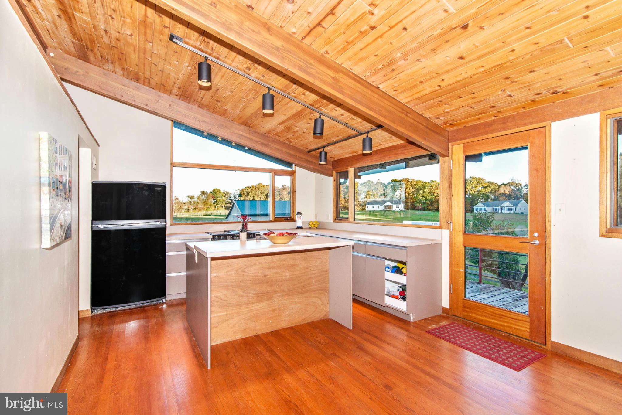 3160 Sumantown Road Middletown, MD 21769 - Photo 13 of 25 a kitchen with stainless steel appliances granite countertop a refrigerator a stove and a wooden floors