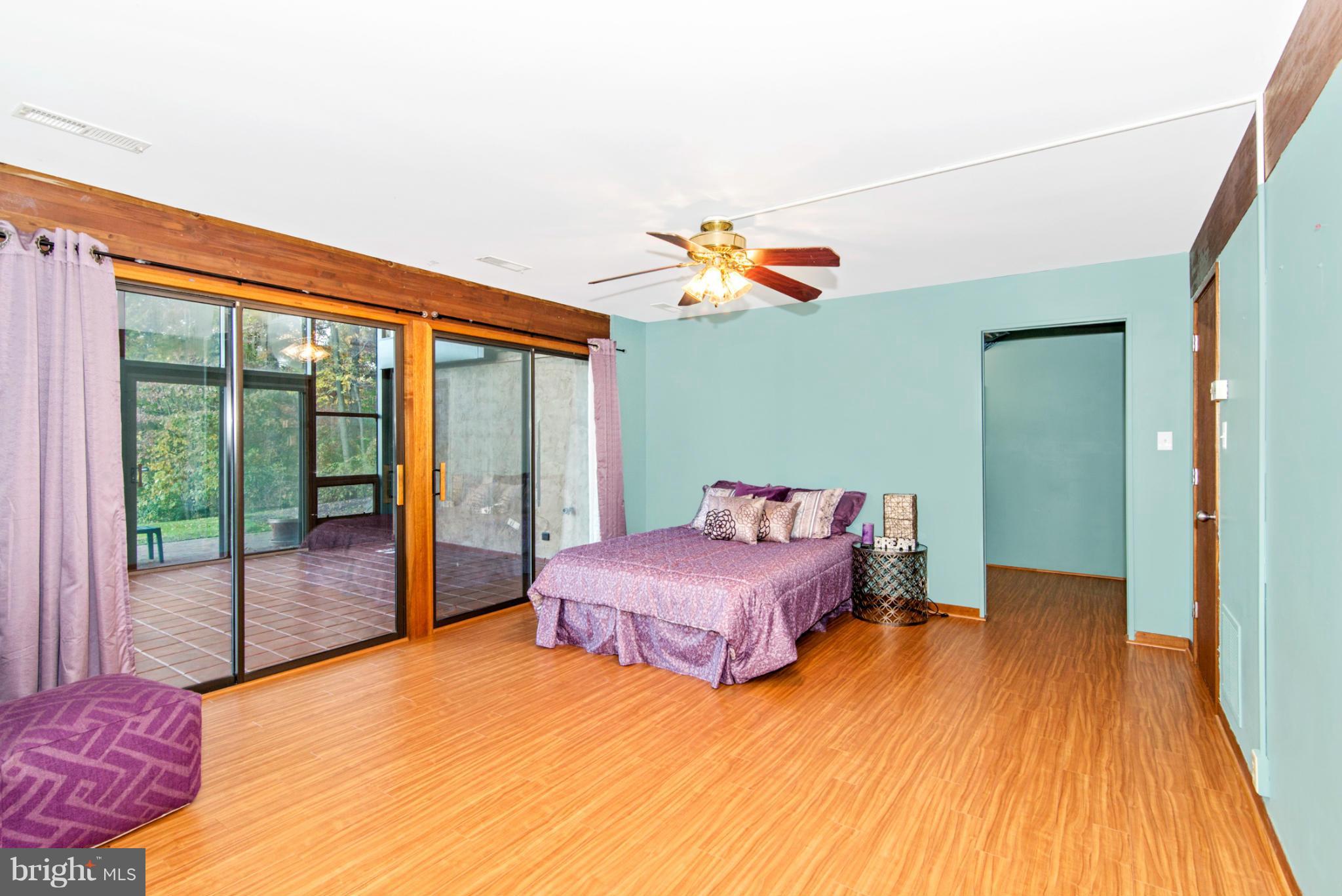 3160 Sumantown Road Middletown, MD 21769 - Photo 17 of 25 a bedroom with a bed and wooden floor