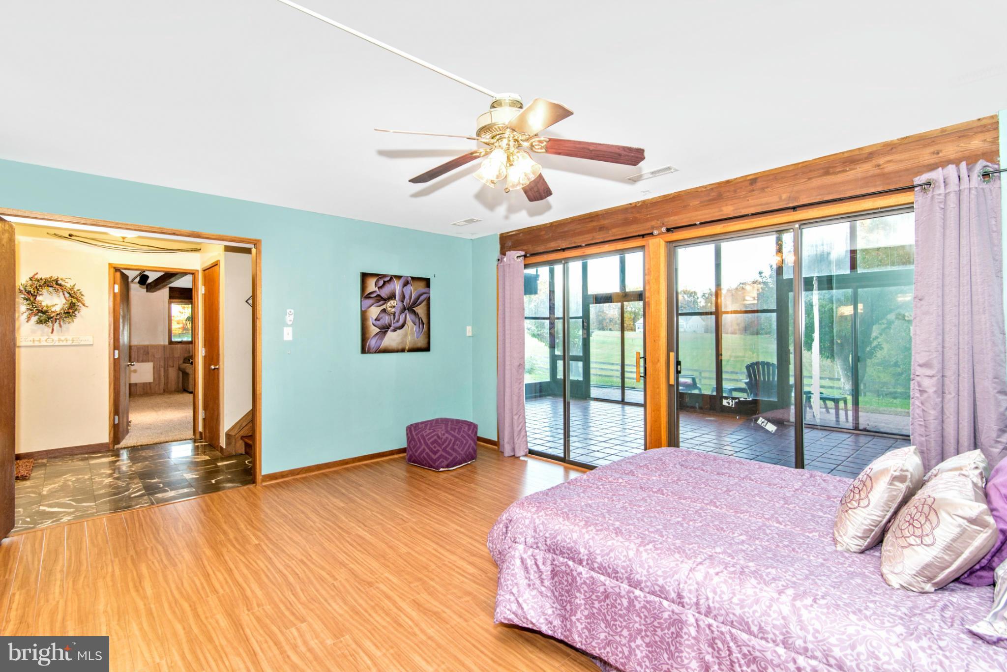 3160 Sumantown Road Middletown, MD 21769 - Photo 19 of 25 a bedroom with a bed and a large window with the outer view