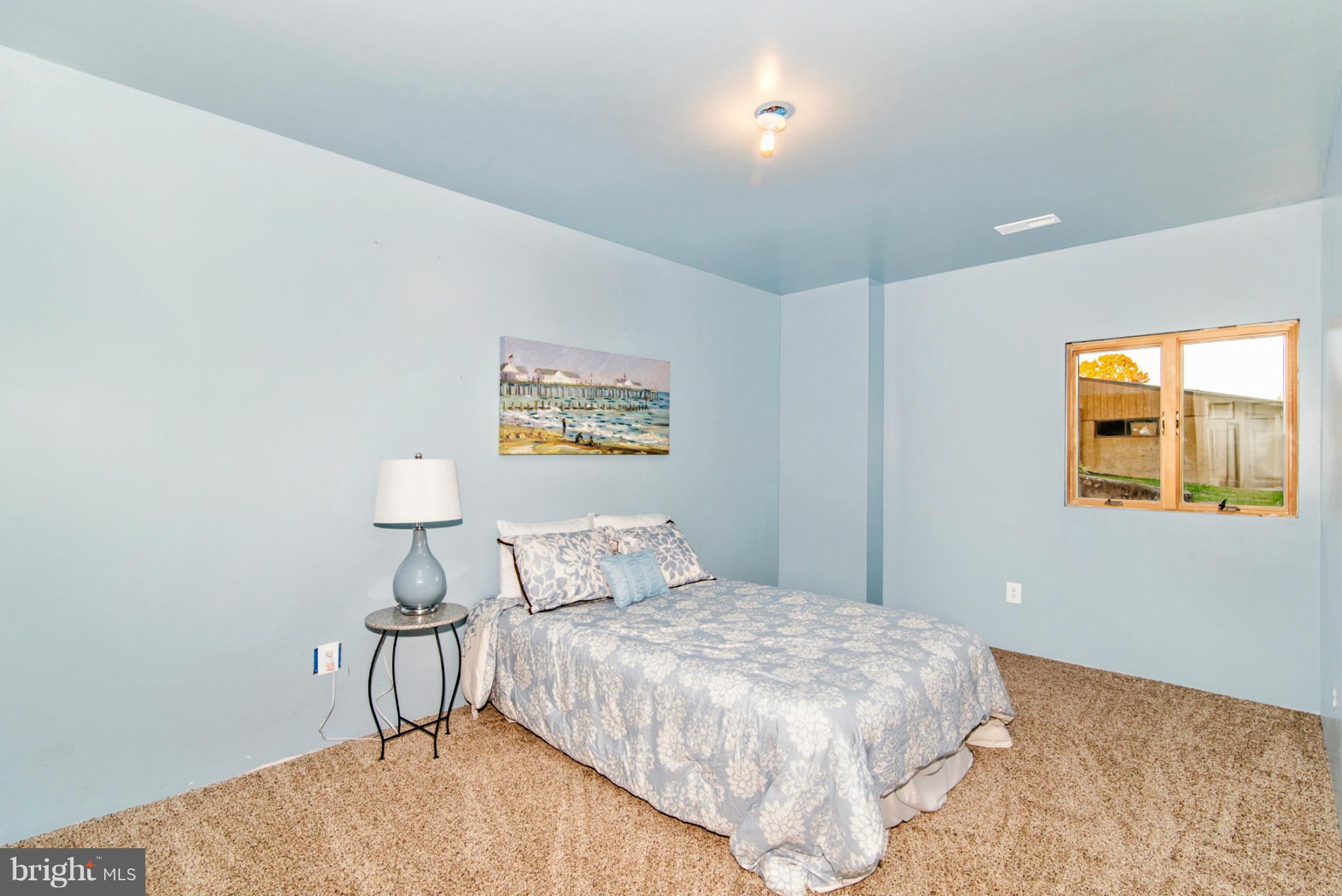 3160 Sumantown Road Middletown, MD 21769 - Photo 21 of 25 a bedroom with a bed and painting on the wall