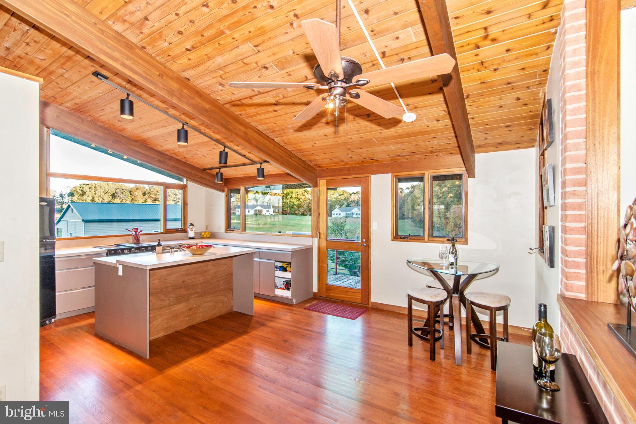 3160 Sumantown Road Middletown, MD 21769 - Photo 6 of 25 a view of a dining room with furniture window and wooden floor