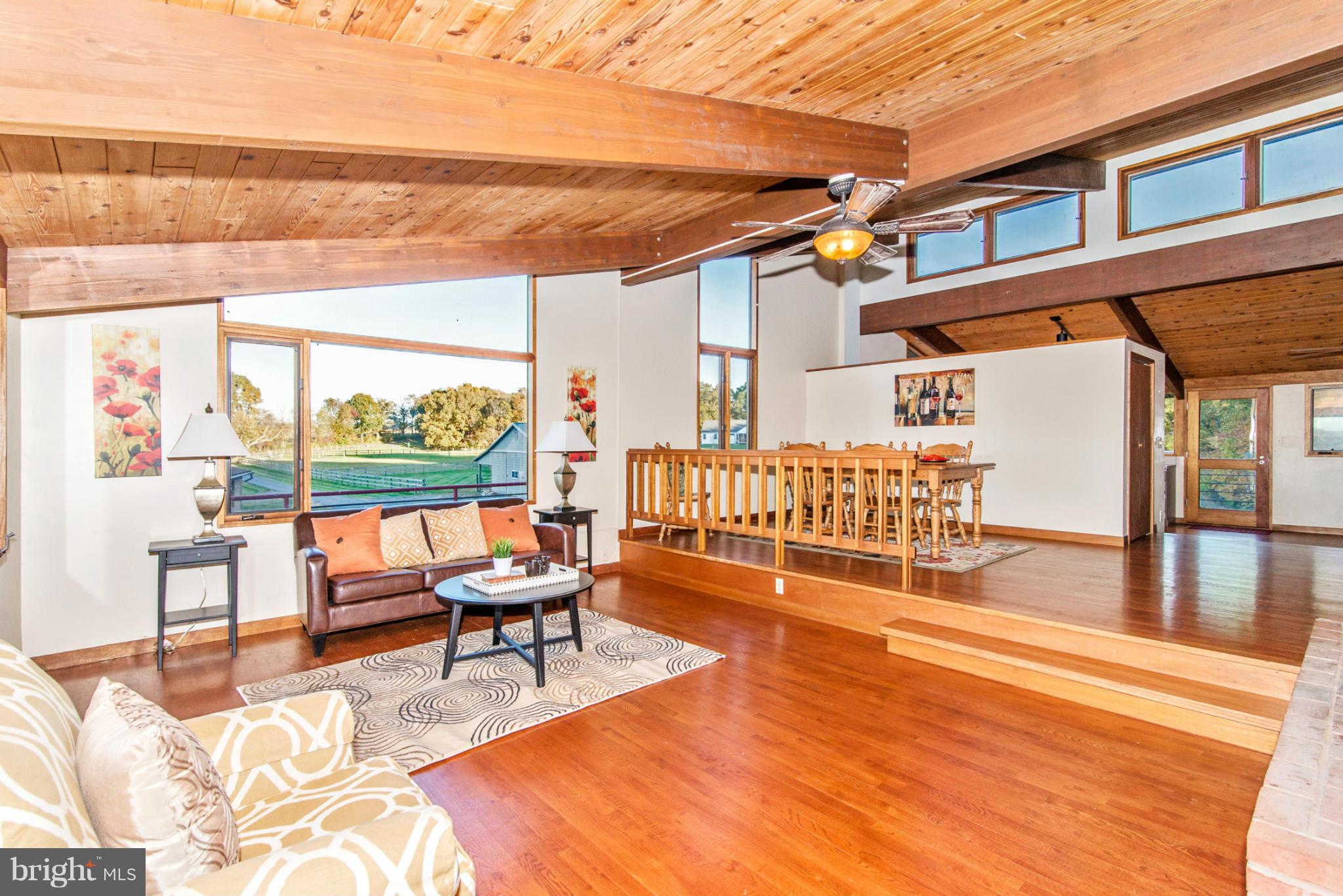 3160 Sumantown Road Middletown, MD 21769 - Photo 7 of 25 a balcony with chairs and wooden floor