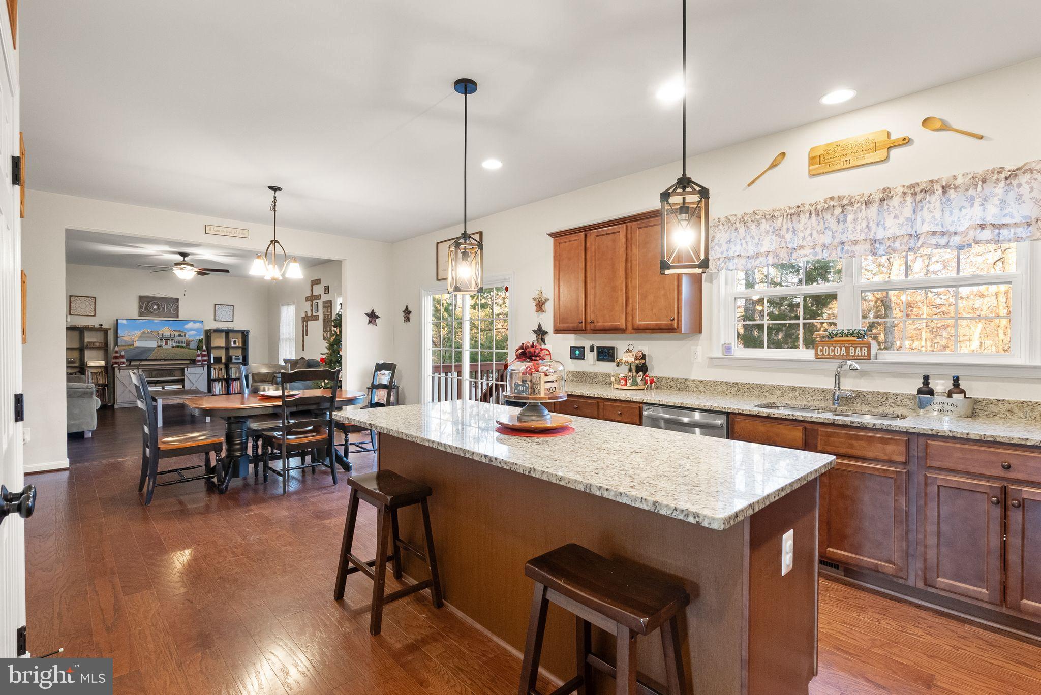 2219 Wildflower Way Locust Grove, VA 22508 - Photo 13 of 49 a kitchen with lots of counter top space and dining table
